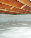 a moisture barrier installed on the walls and floors of a crawl space in Essex